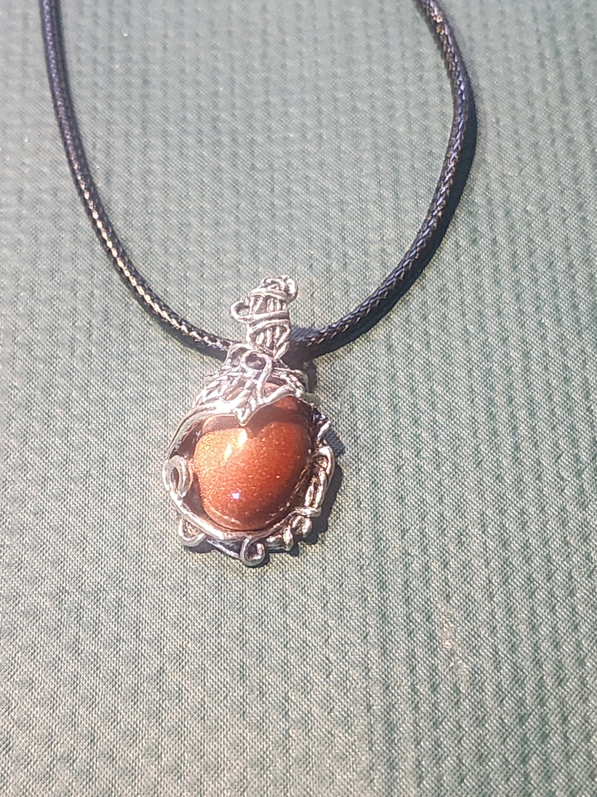 Stone pendant with beautiful silver outerlay