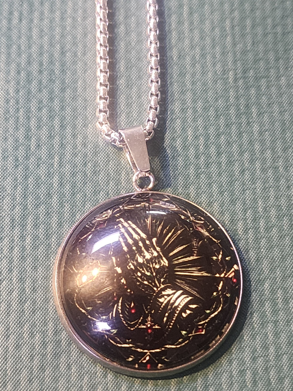 Praying hands necklace